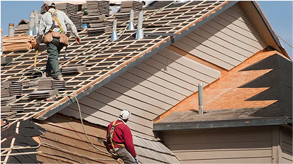Workers removing tiles from the roof.