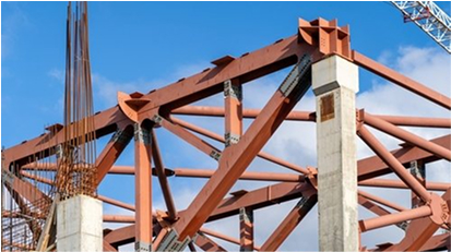 Steel beams forming the framework of a building under construction.