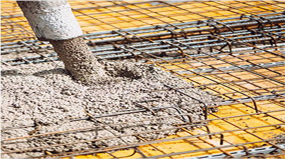 Concrete being poured over rebar for a reinforced slab foundation