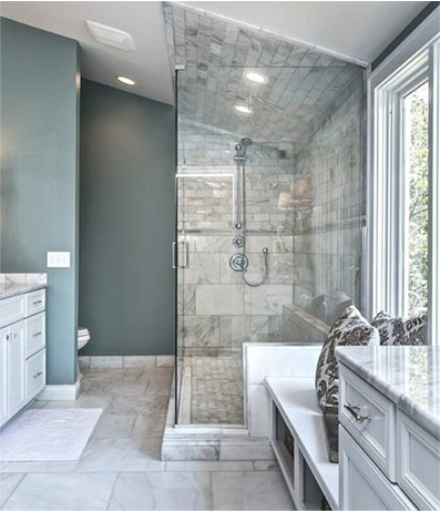 Luxurious walk-in shower with marble walls and ceiling, glass door, built-in bench, and chrome fixtures, adjacent to a double vanity with under-mount sinks