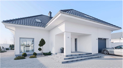 Modern white house with freshly painted exterior under a clear blue sky.