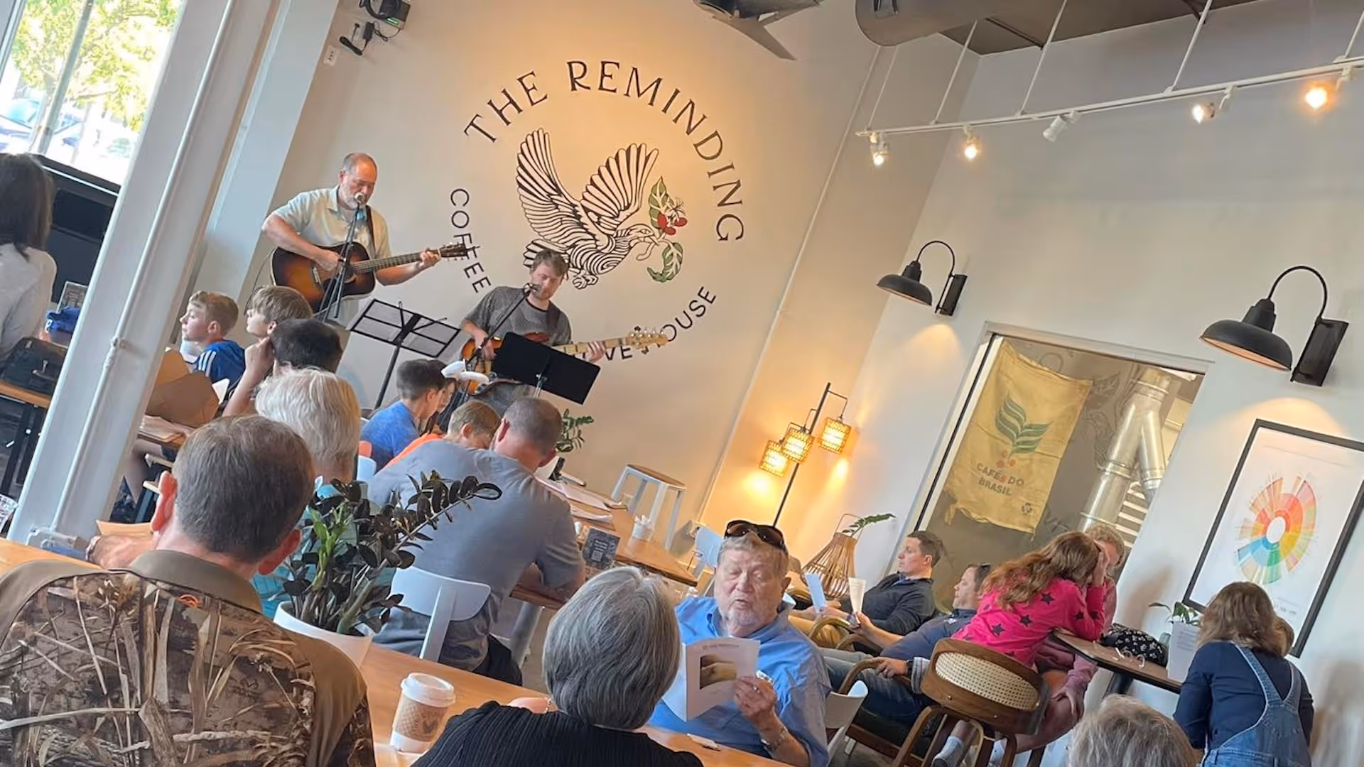 A member church of the Northshore Gospel Network (Faith Presbyterian Church) singing at a worship event at The Reminding Coffee + Creative House in Covington