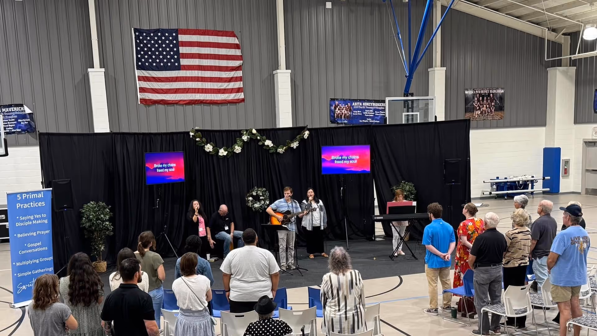 A member church of the Northshore Gospel Network (SweetWater Church) gathering for worship in a gym.