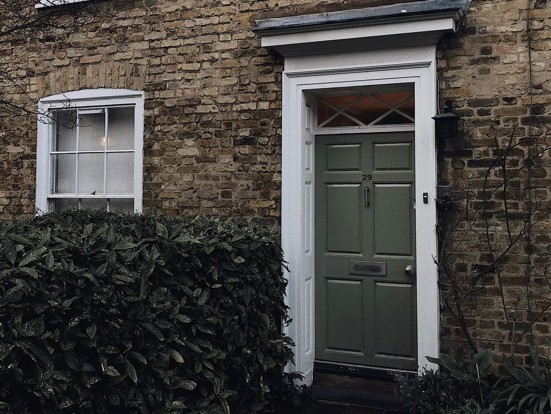 Front door of a renovated UK home, representing smart property buying at the right price.