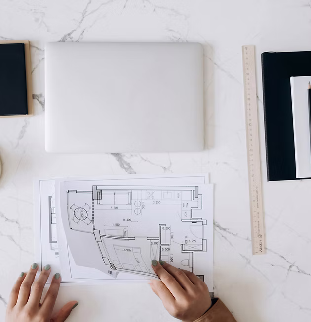 Architect reviewing commercial property redevelopment plans, ideal for planning office-to-retail conversions in Yorkshire.