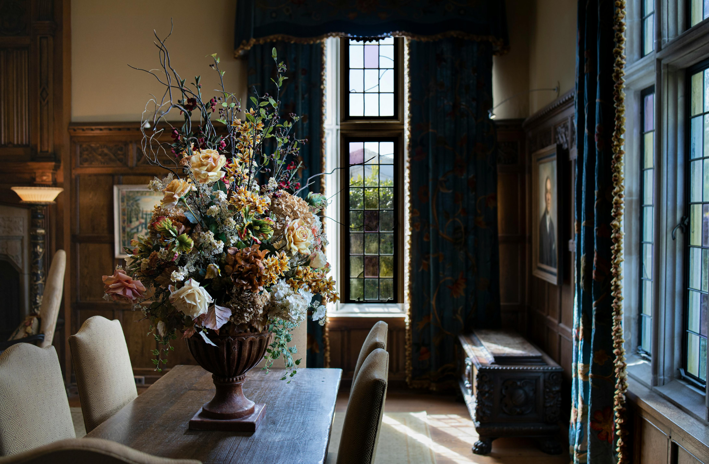 Elegant dining room design with floral centrepiece, wood-panelled walls, and traditional Yorkshire styling.
