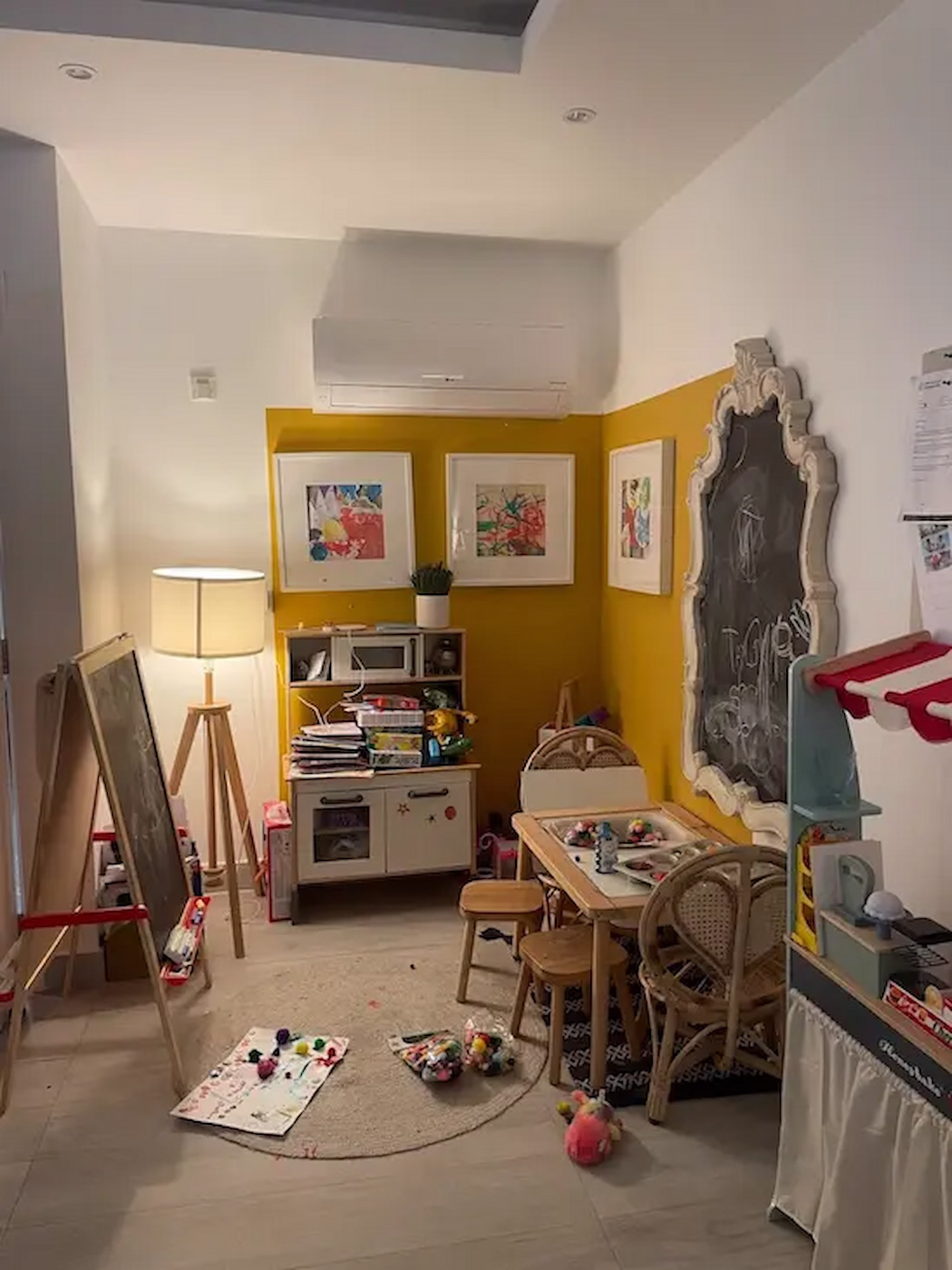 Smart storage solutions in children’s playroom with open shelving, baskets, and soft pastel tones keeping the space tidy and inviting.