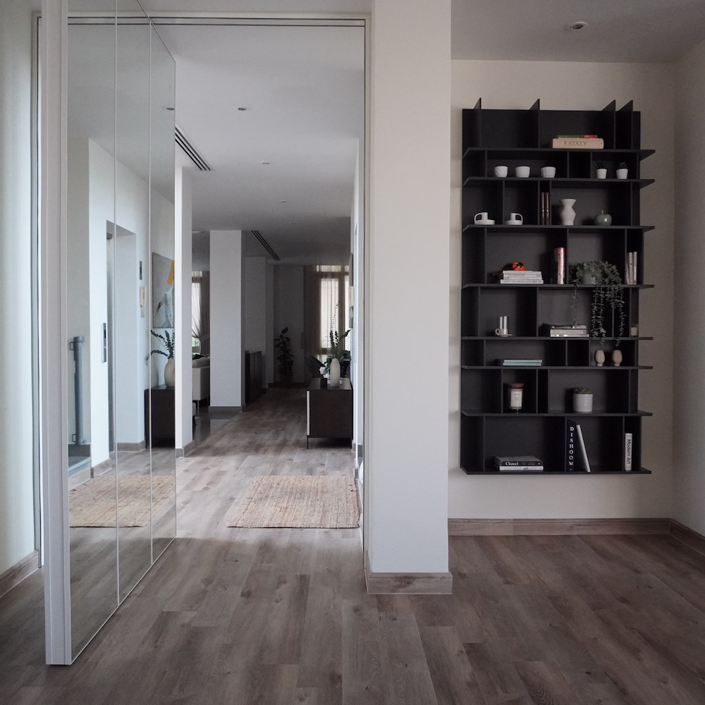 Elegant hallway decor designed by Roberts Renovations, featuring bespoke shelving and styled accessories that reflect the quality and attention to detail of their interior design packages.