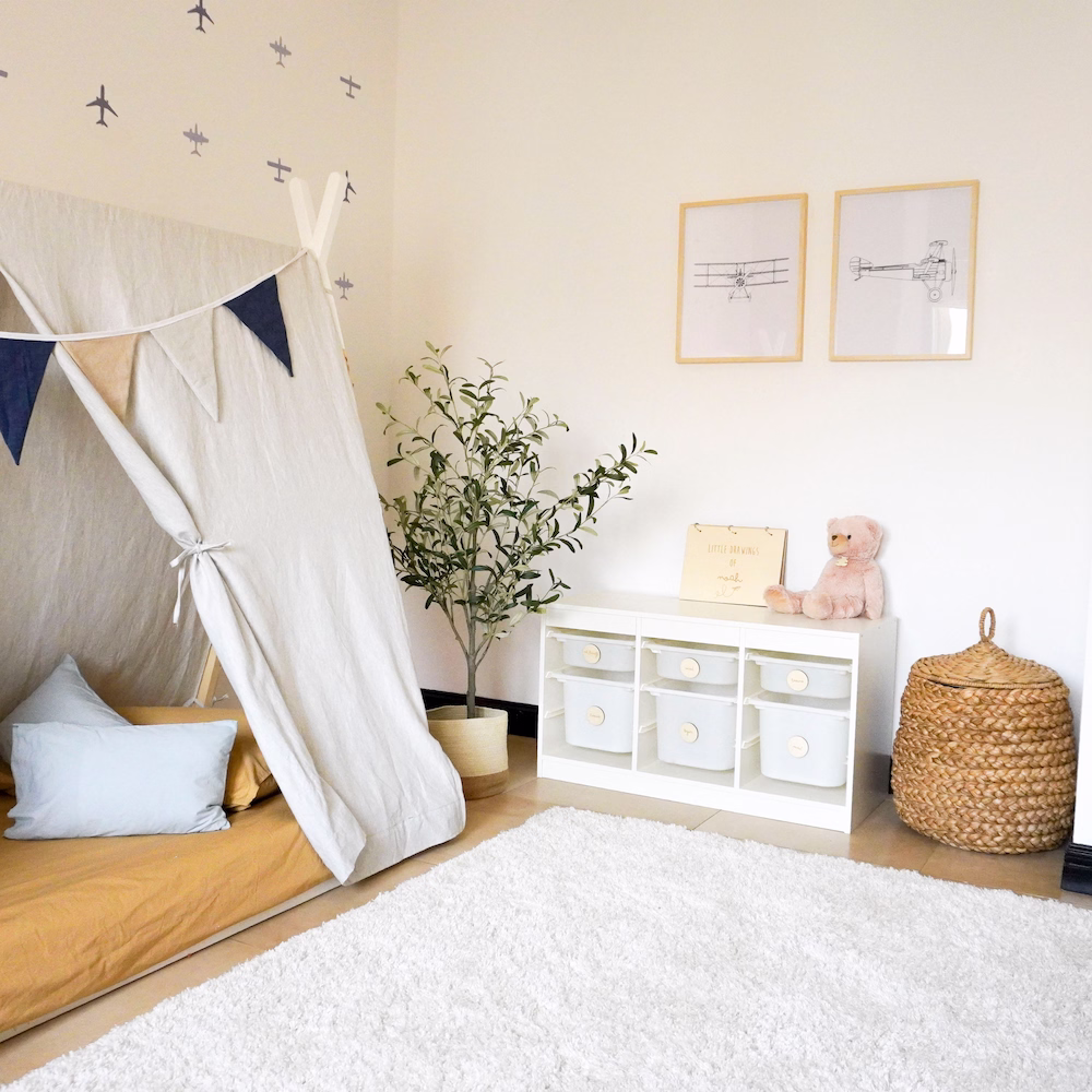 Spacious boys’ bedroom with playful layout, wooden furnishings, and aeroplane décor designed by Roberts Renovations.