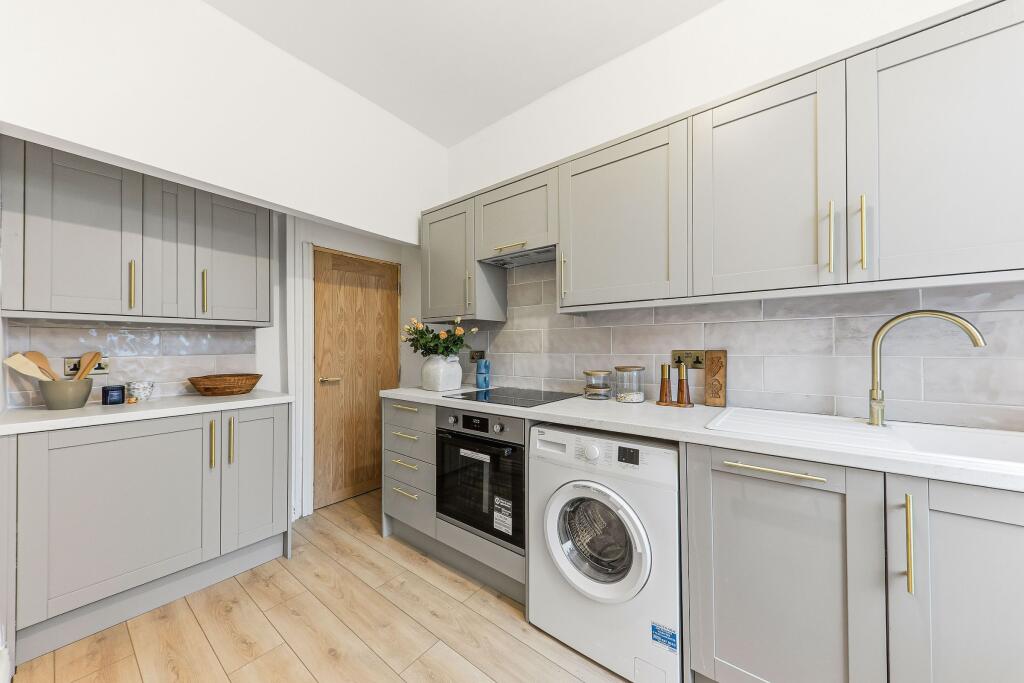 Kitchen transformation in Pudsey BTL project with quartz worktops and Gold hardware