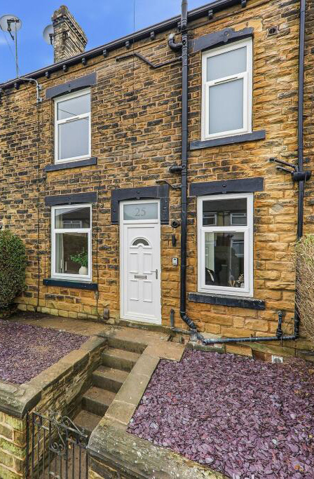 Exterior view of renovated stone terrace buy-to-let property in Pudsey, Leeds with new double-glazed windows and improved façade