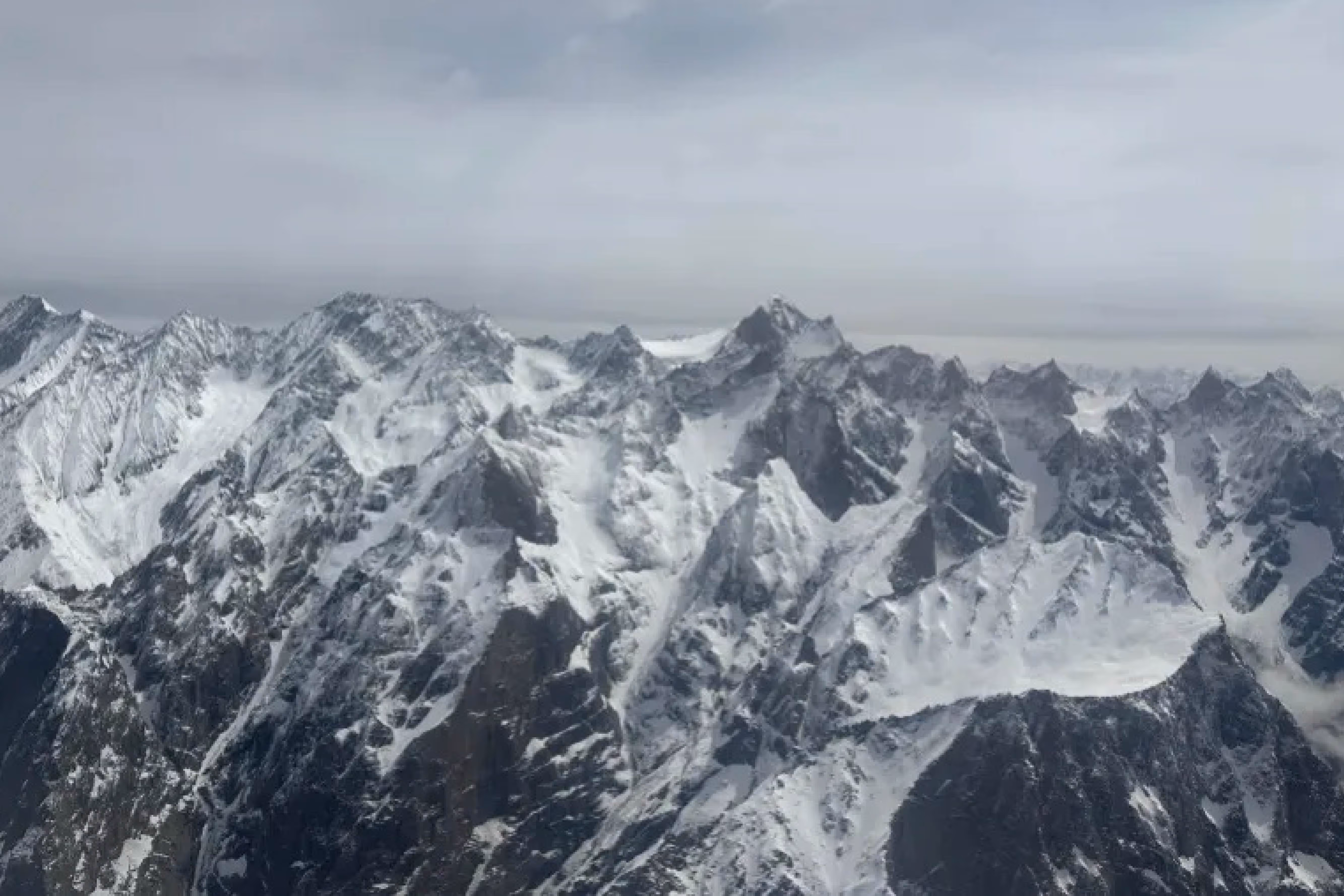 aerial shot of mountains against a white sky