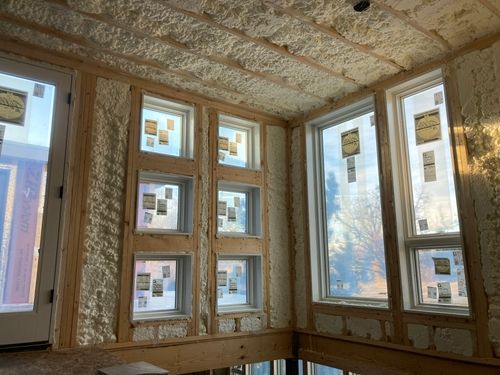 Wood framing with windows and spray foam insulation