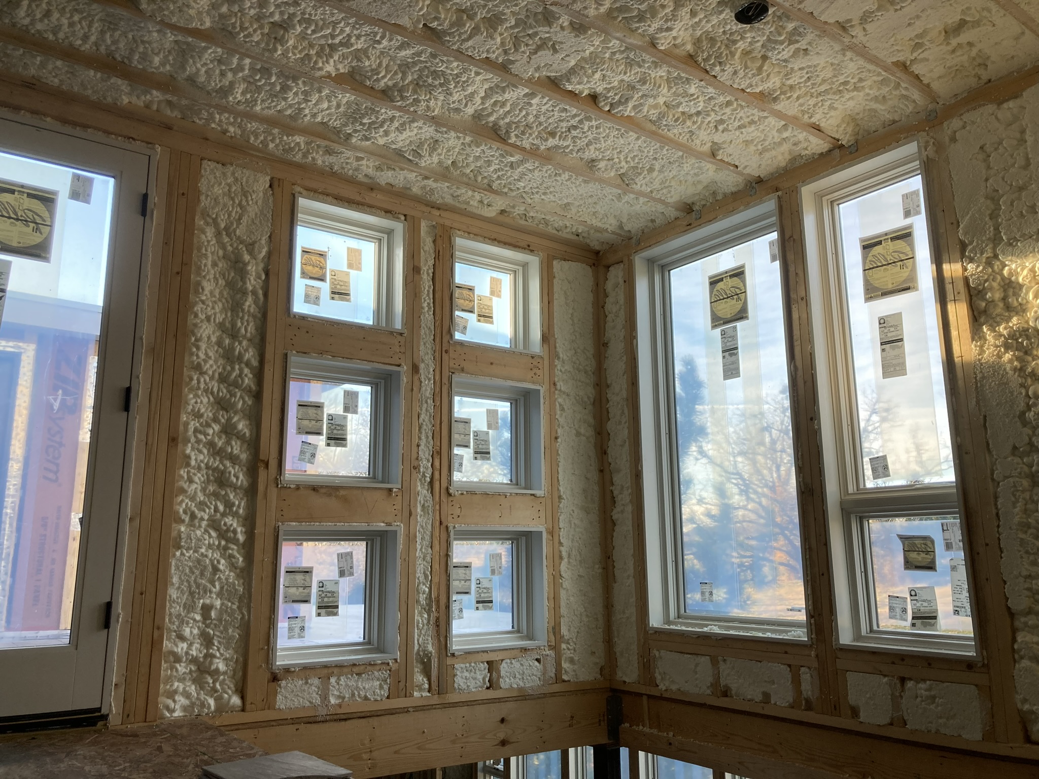 Wood framing with windows and spray foam insulation