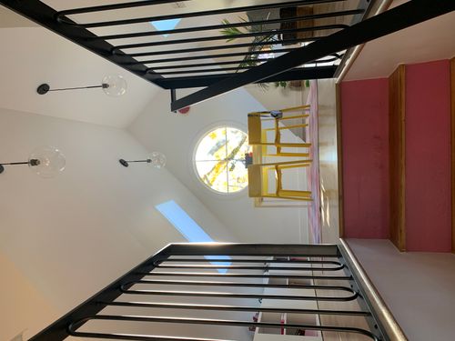 Pink stairs and oculus window