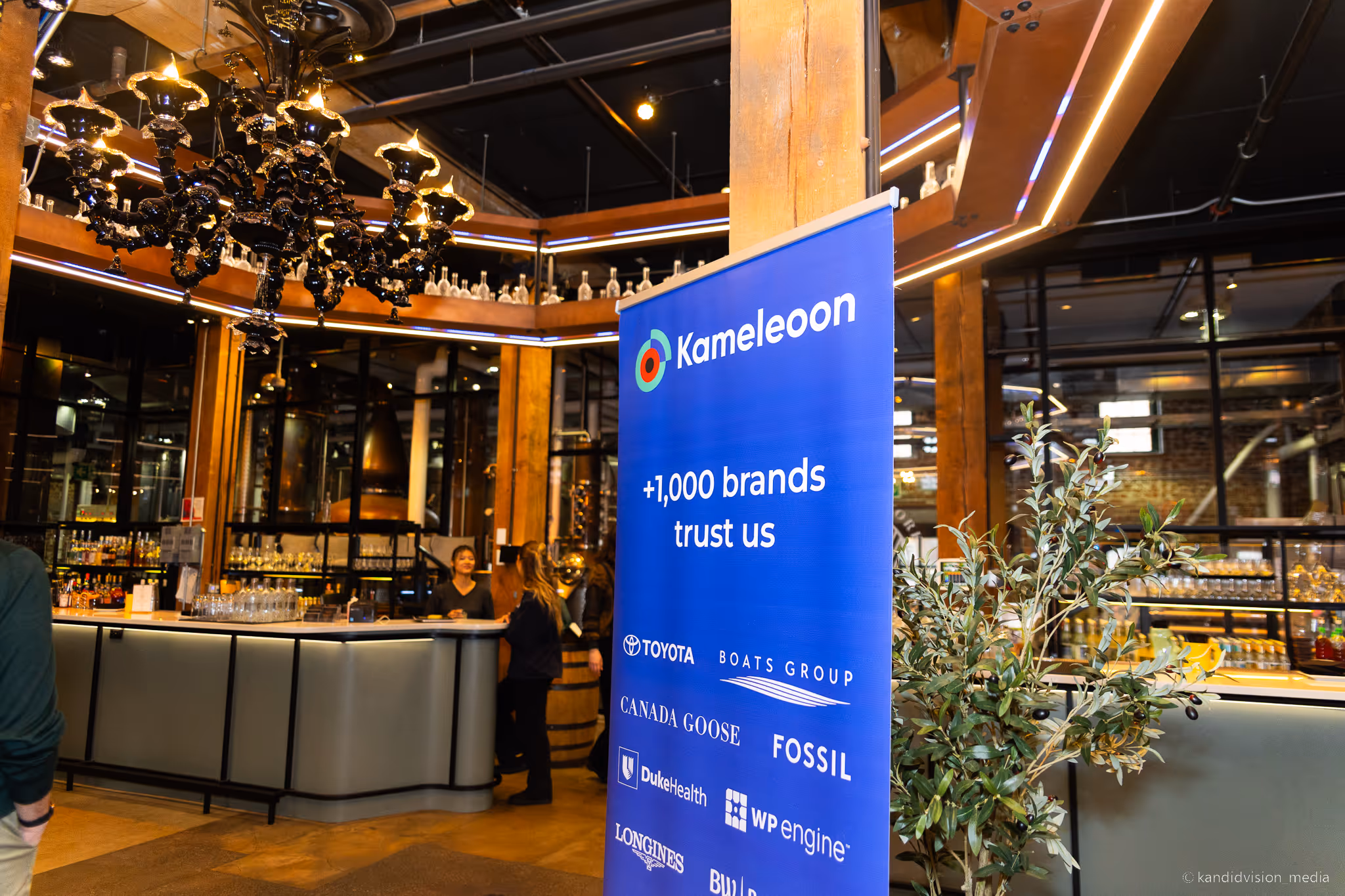 A banner displayed at EXL UNITE in Toronto, 2025.