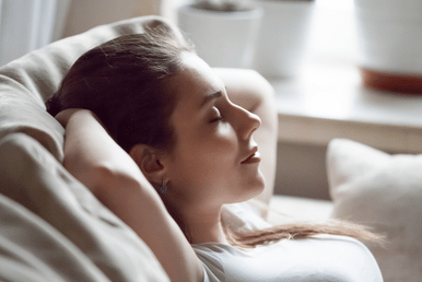 Sitting in quiet taking a moment to pause, breathe and be, promoting a sense of wellbeing and calm