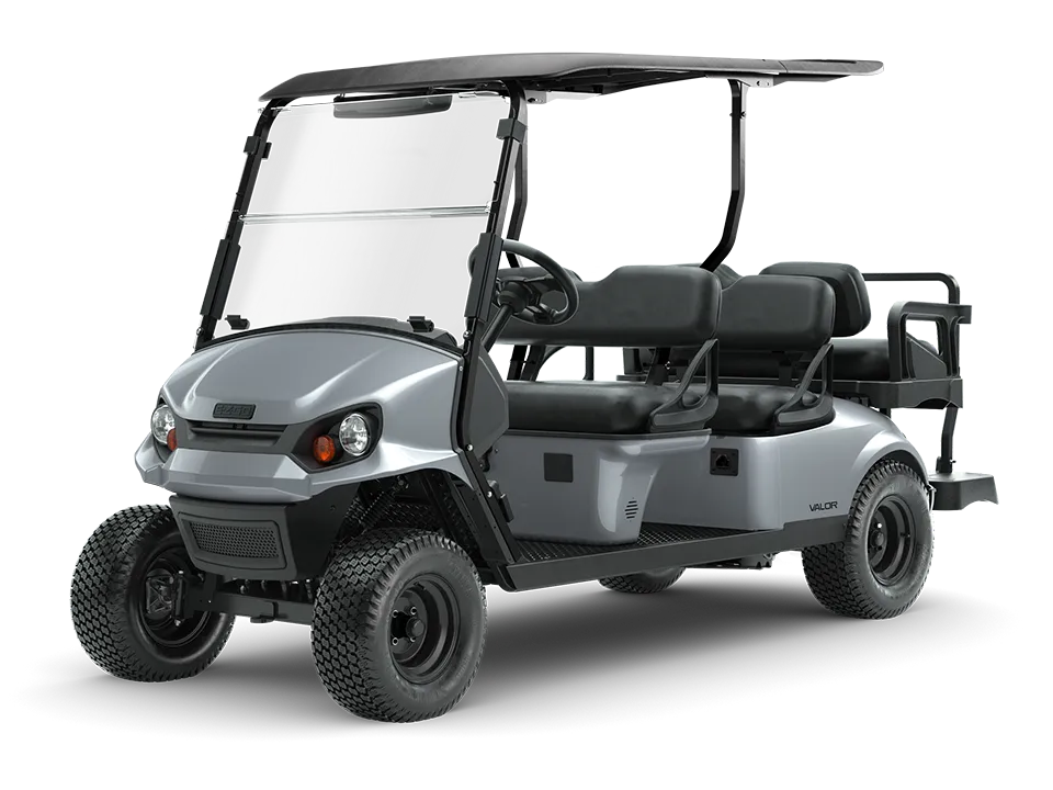 A silver four-seater golf cart with a black roof, large tires, and a clear windshield, viewed from the front left angle.