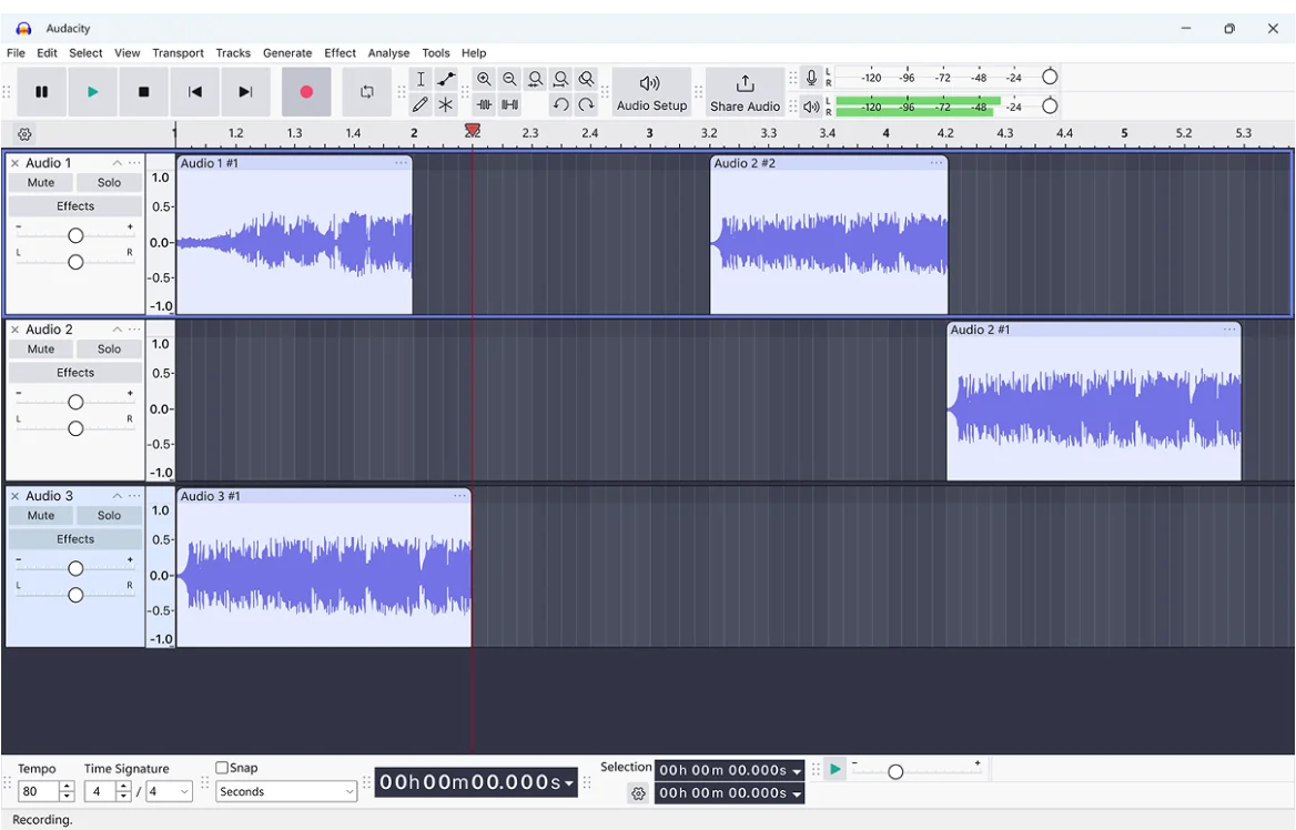 Audacity audio editing software interface showing three audio tracks with waveforms arranged on the timeline and playback controls at the top.