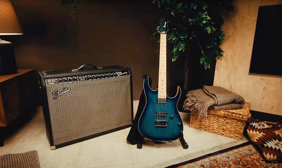 Muse Group community gear: electric guitar with amplifier for music creation and performance