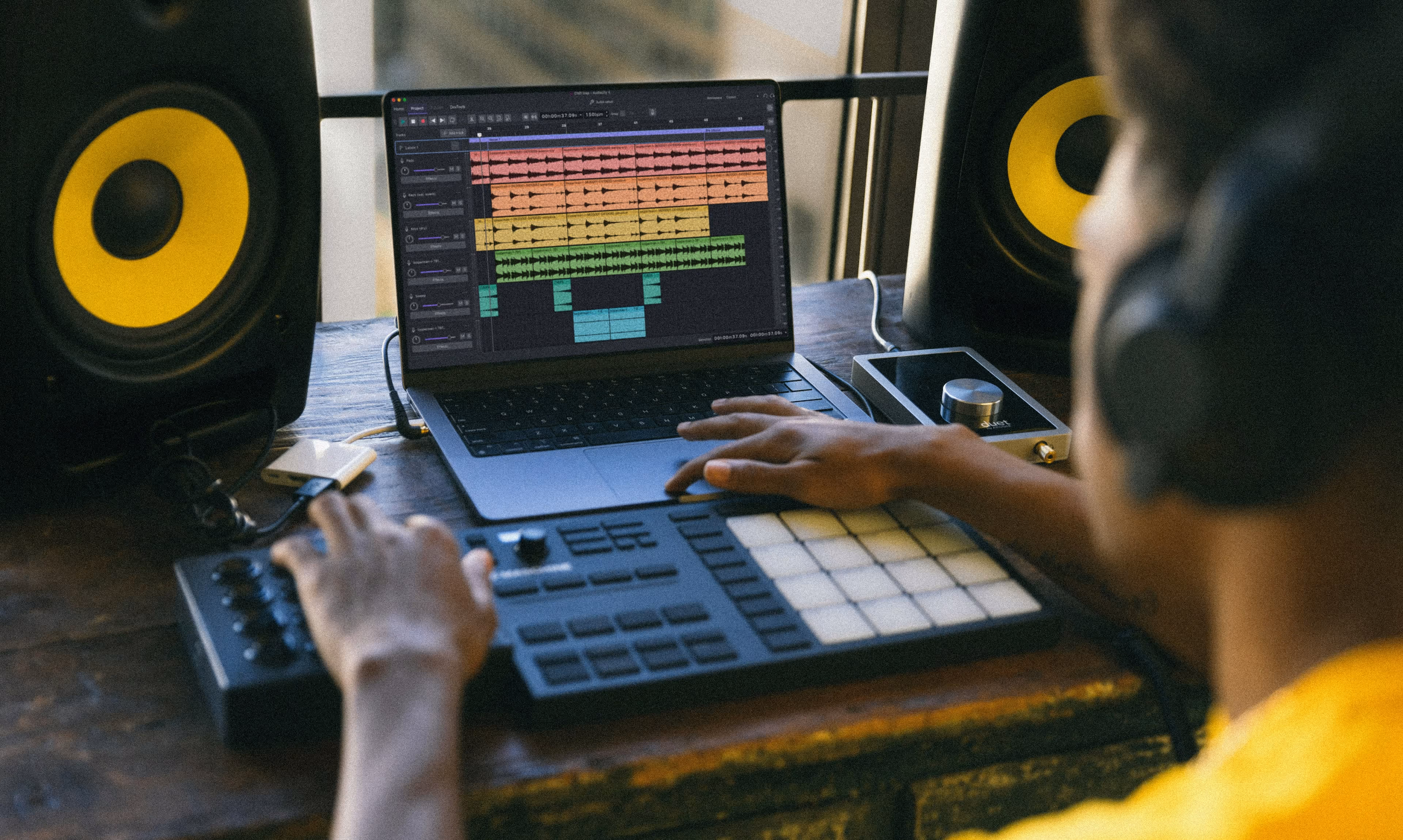 Muse Group musicians collaborating with Audacity music software and MIDI keyboard recording setup