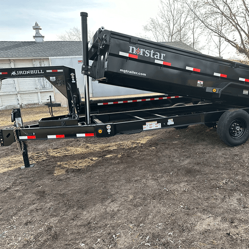 16x7 Norstar dump trailer with heavy‑duty steel bed and hydraulic lift, designed for hauling and dumping materials on construction and landscaping job sites