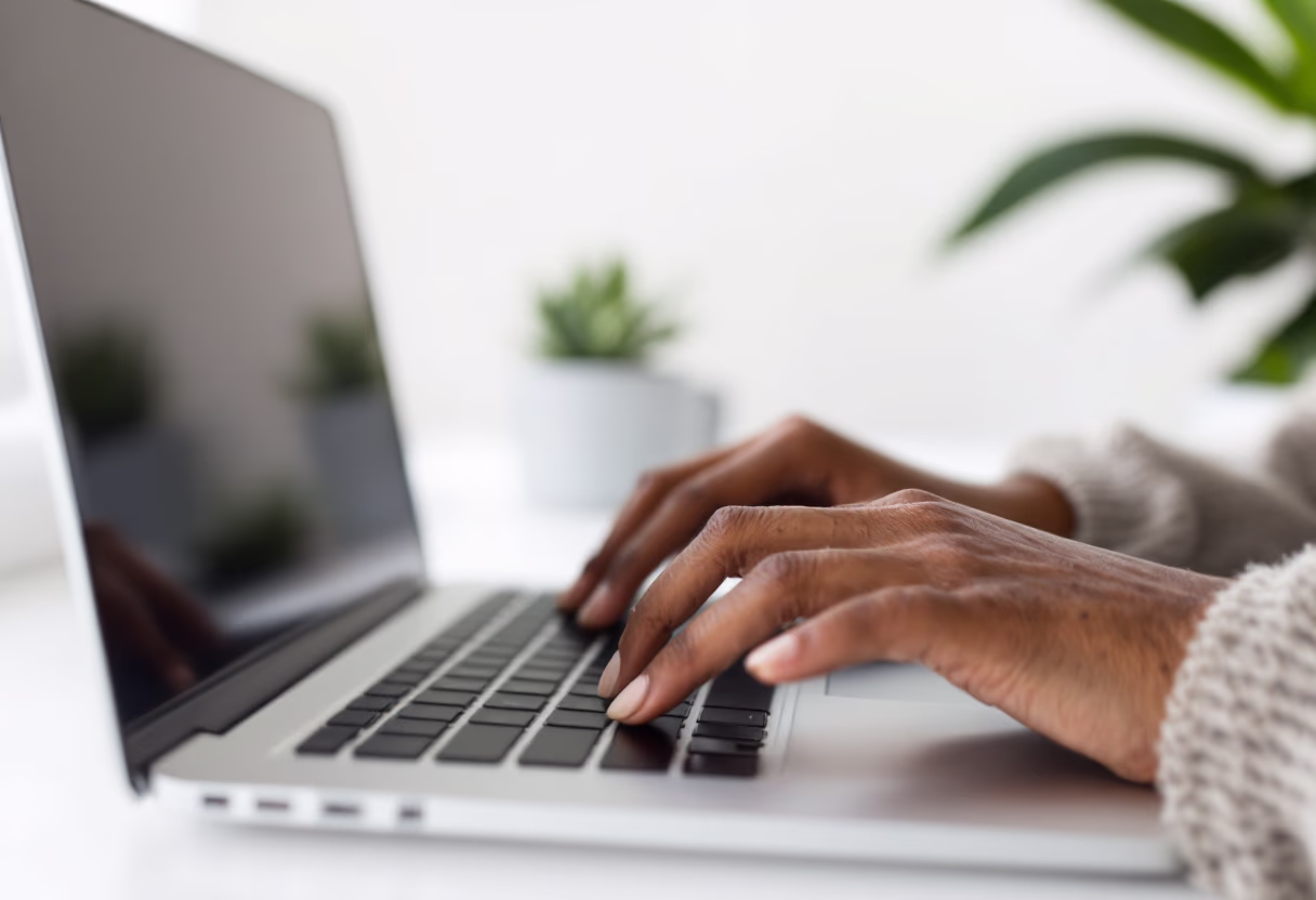 image of an individual typing on a laptop (for a productivity tools business)