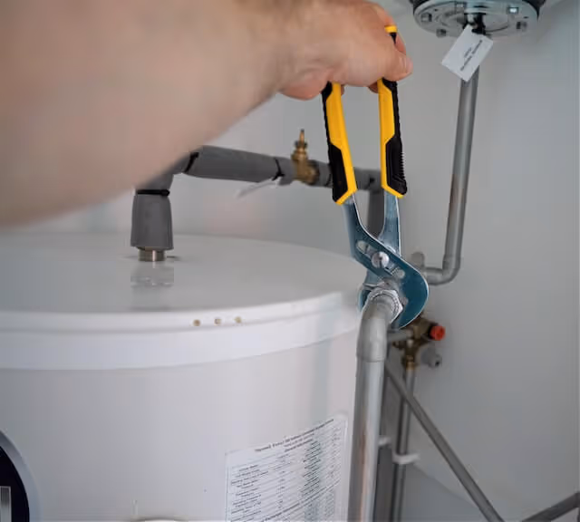 Hands operating a cordless lift system on shades.