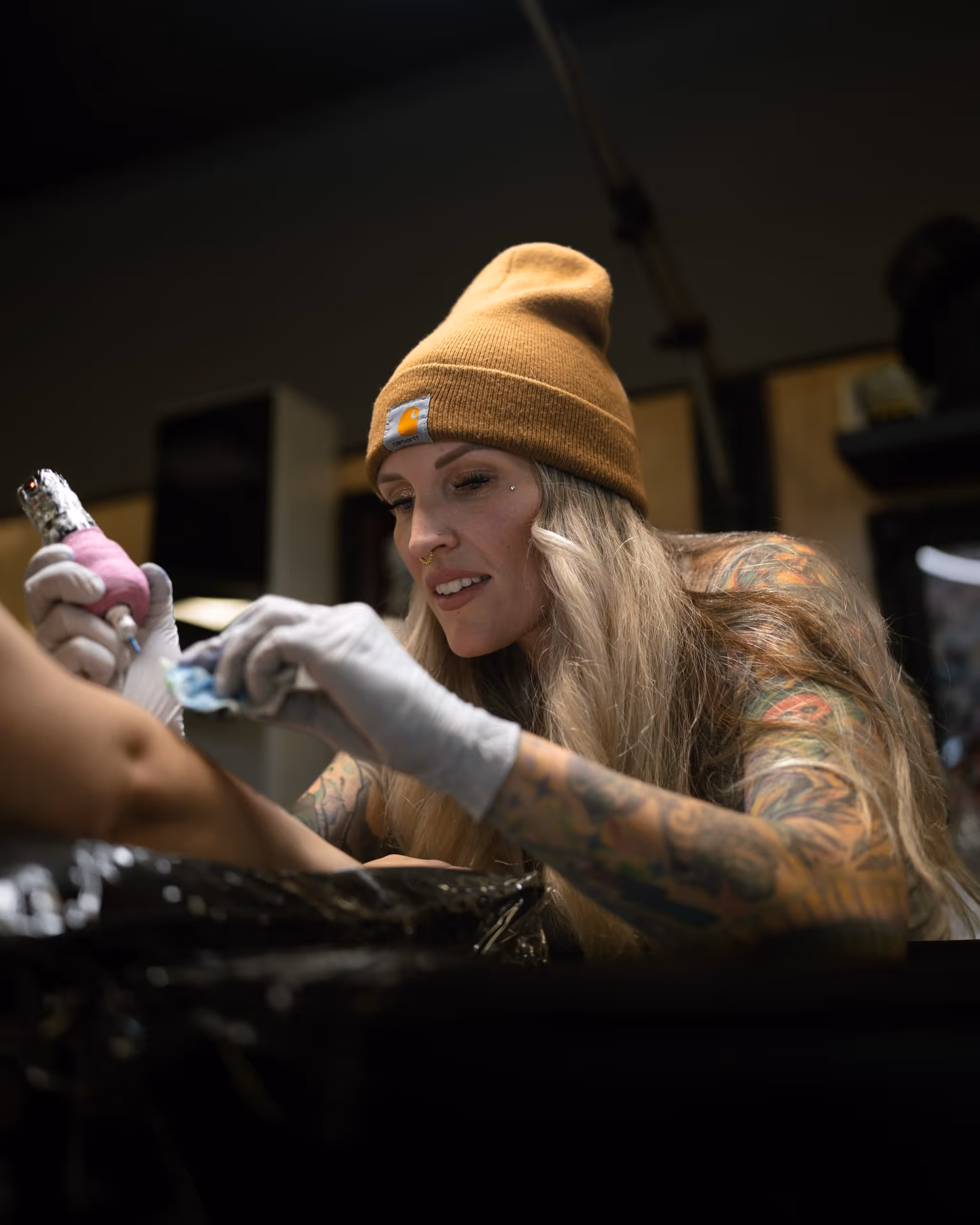 A woman with a tattoo on her arm.