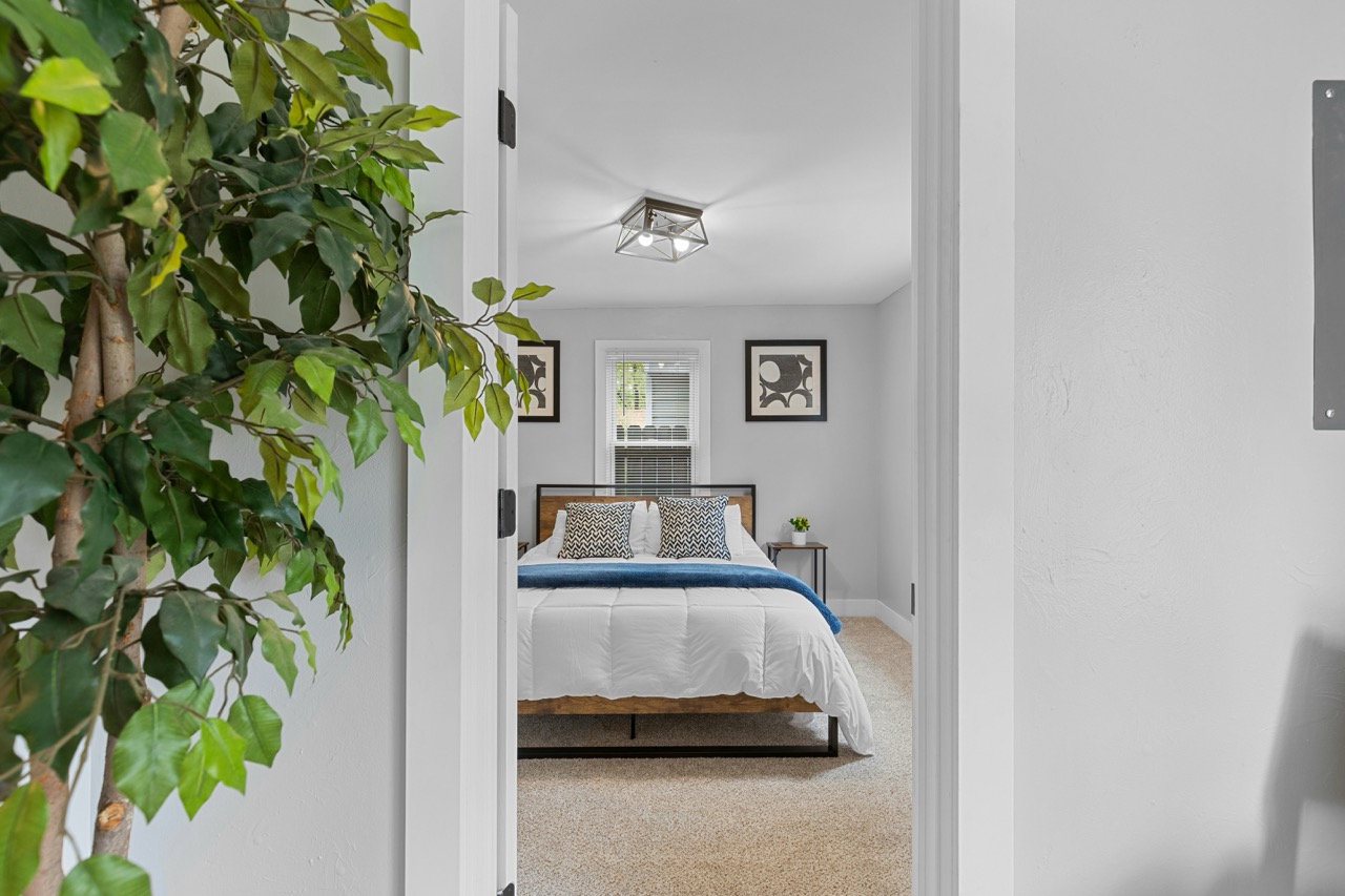 Modern bedroom interior with neutral decor and natural lighting - airbnb investment property