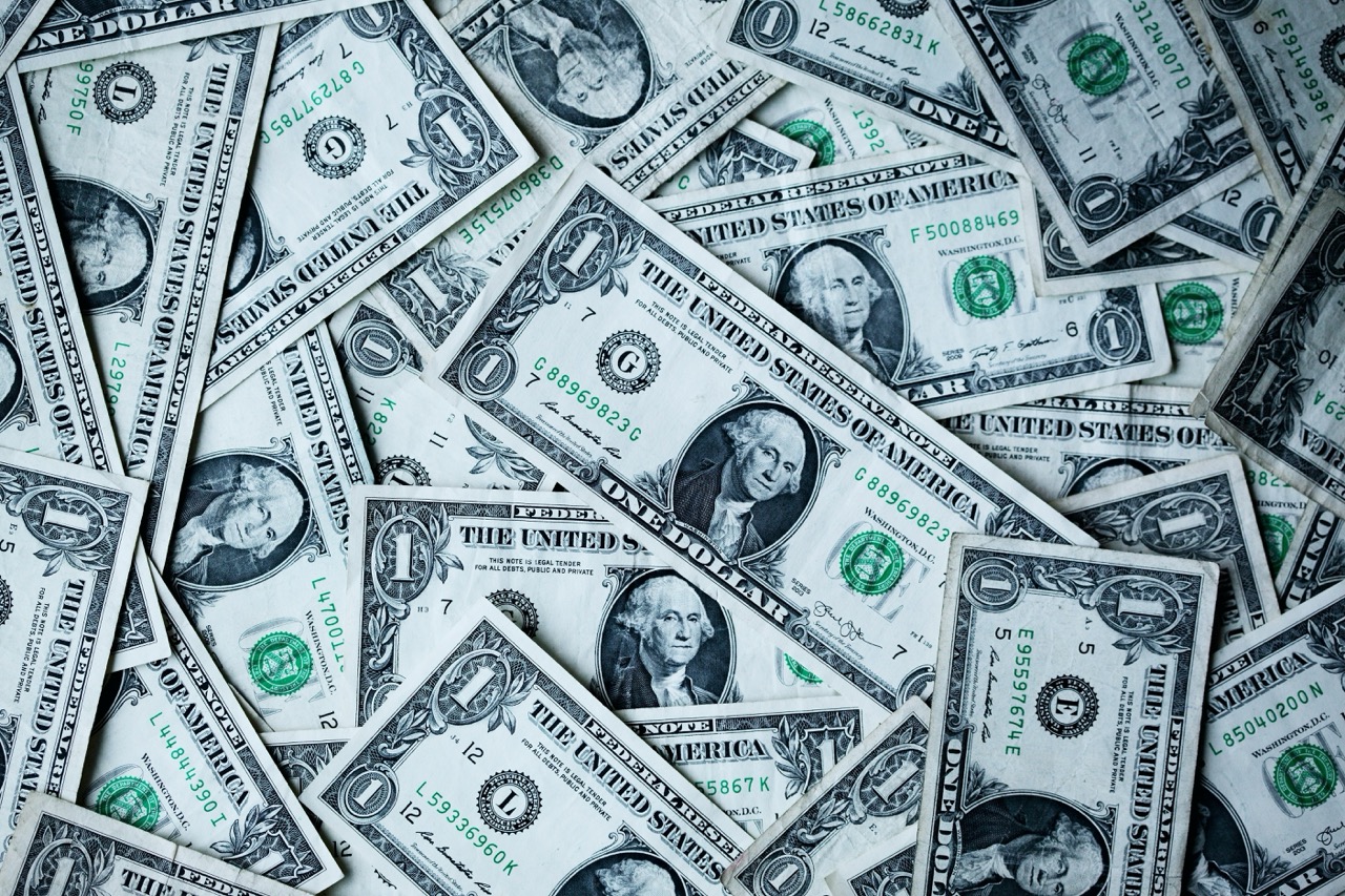 Scattered US dollar bills