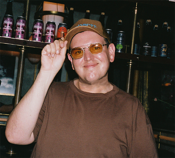 A headshot of Jason Palumbo smiling
