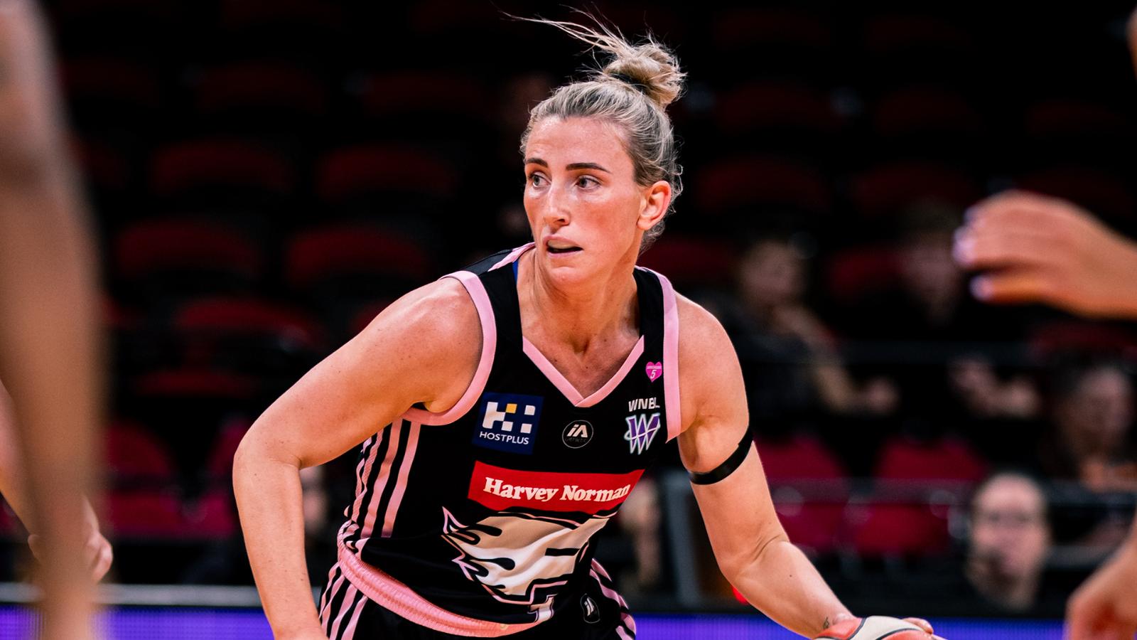 Sydney Flames player driving to the basket in front of the home crowd