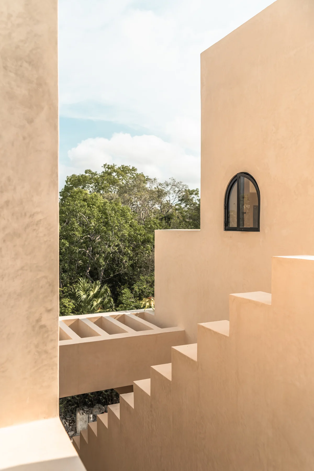Image of a Minimalist Architecture, featuring Stucco Exterior and Exterior Staircase.
