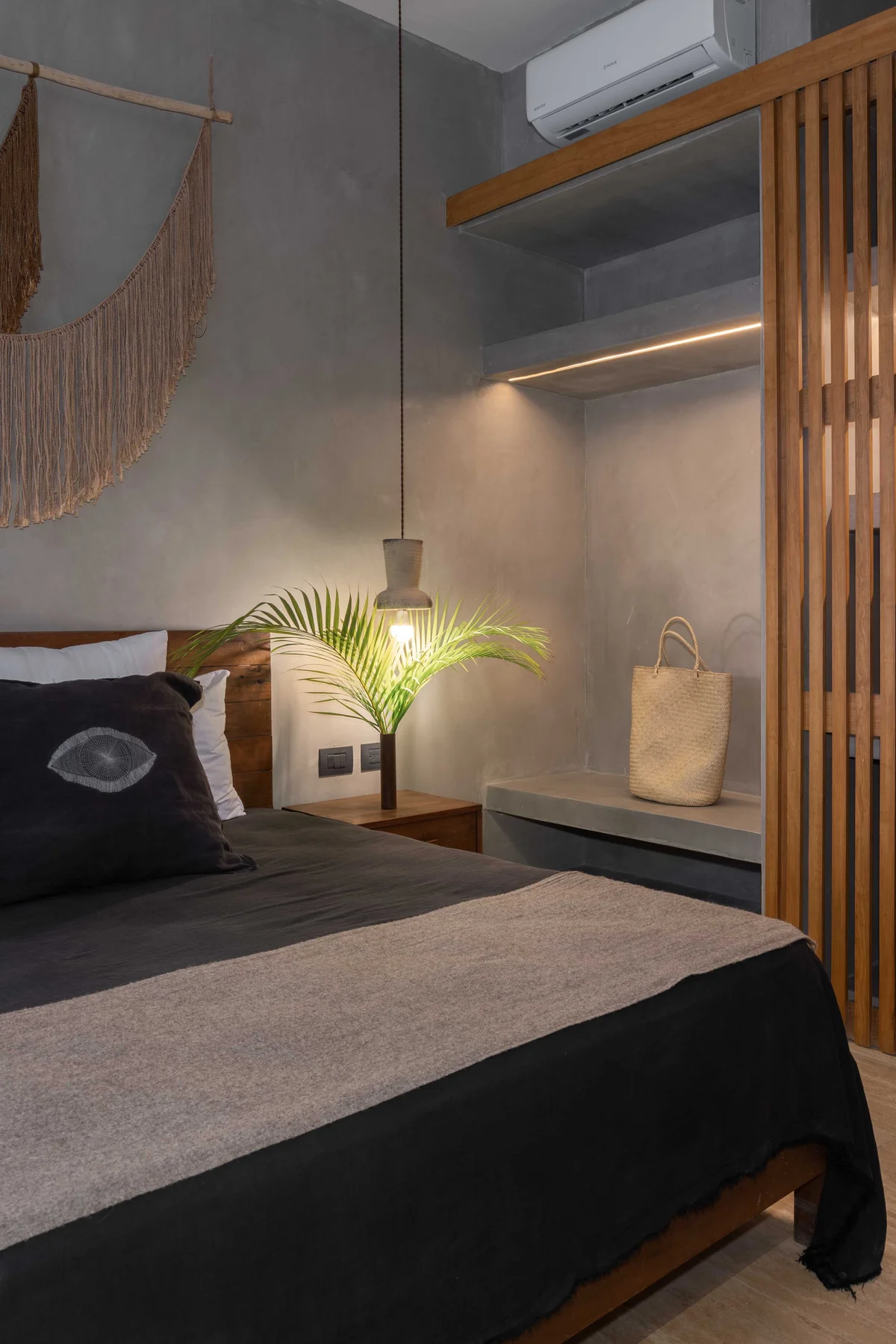 Image of a Modern Bedroom, featuring Concrete Walls and Wood Accents.
