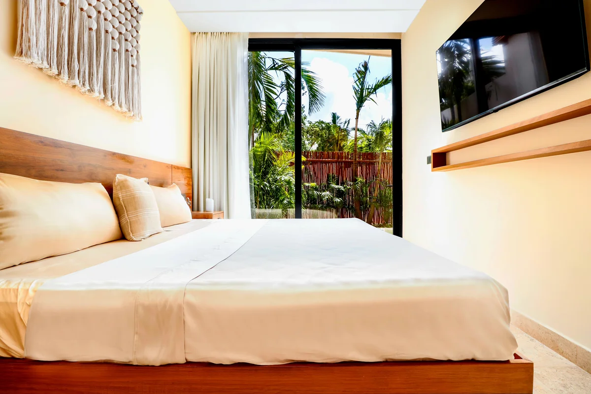 Image of a Bedroom, featuring Garden View and Sliding Glass Doors.