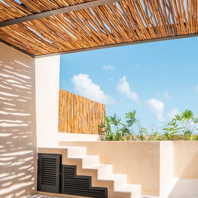 Image of a Rooftop Terrace, featuring Wood Stick Pergola and Outdoor Living Space.
