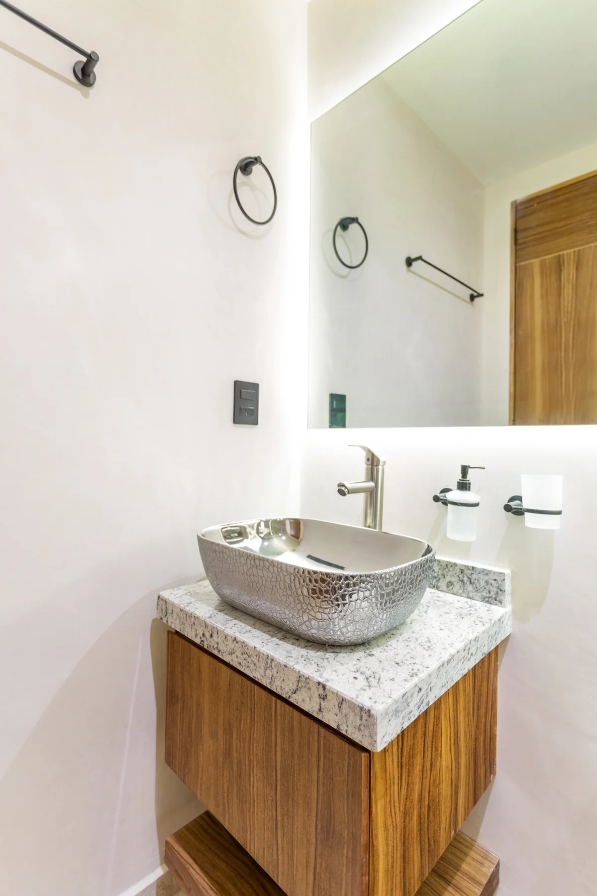 Image of a Modern Bathroom, featuring Floating Vanity and Granite Countertops.