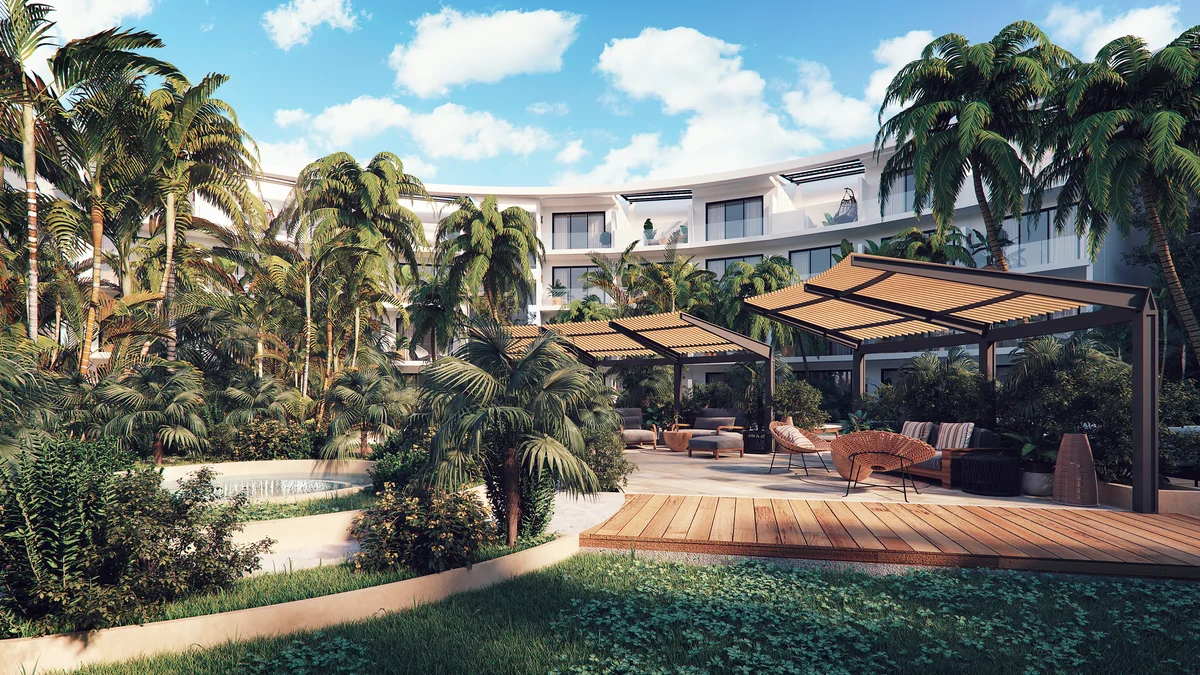 Image of a Resort-Style Courtyard, featuring Lush Tropical Garden and Outdoor Lounge Area.