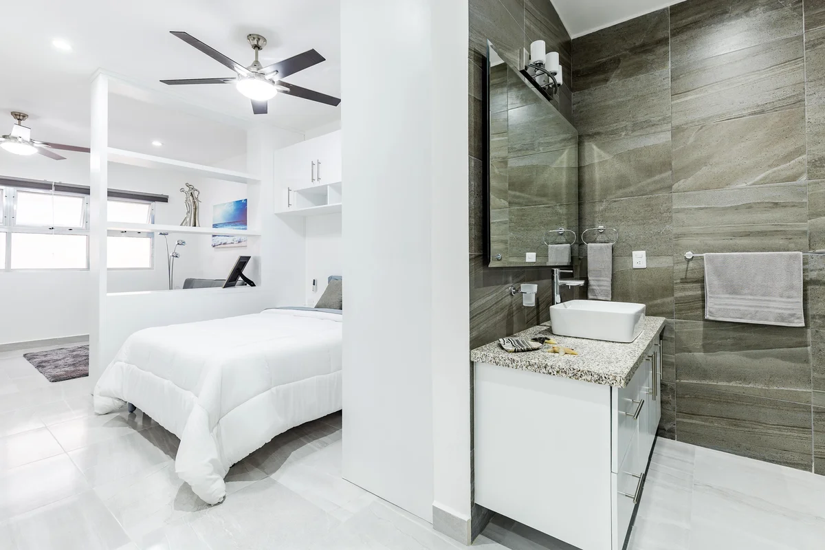 Image of a Modern Bedroom, featuring Contemporary Bathroom and Granite Countertop.