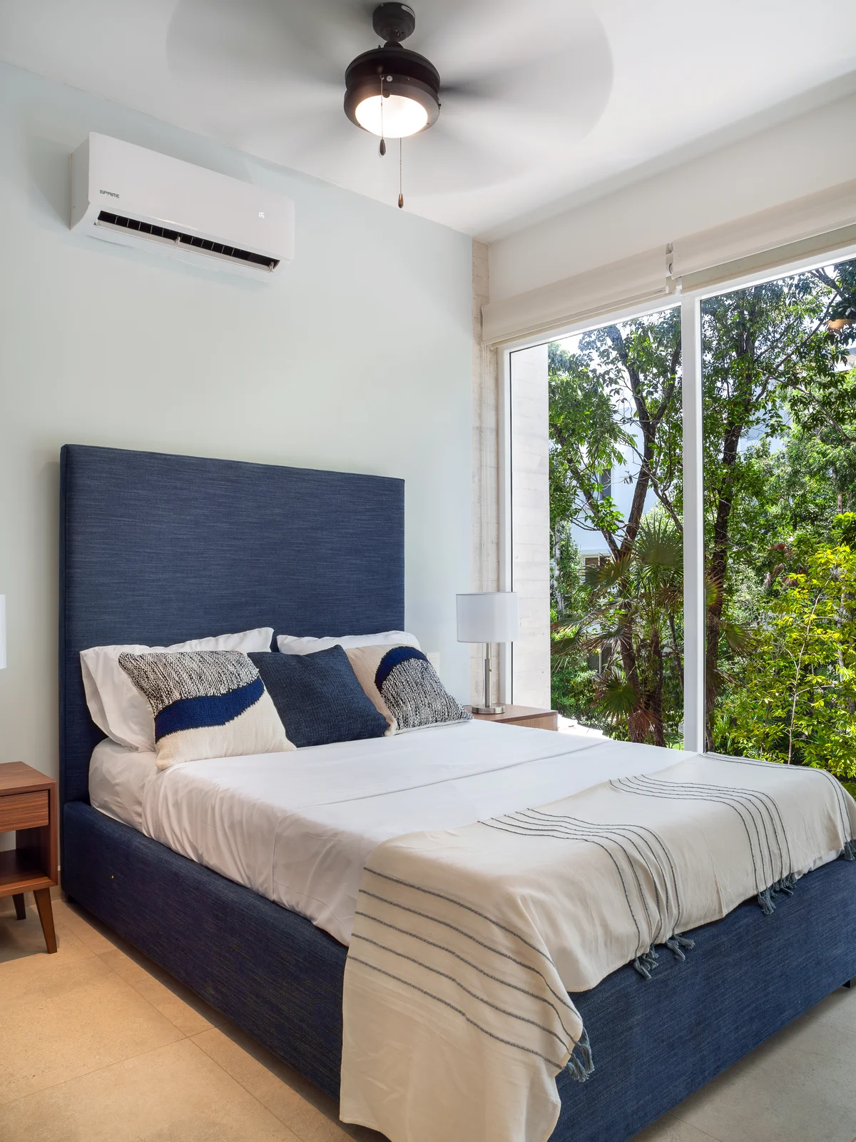 Image of a Bedroom, featuring Floor-to-Ceiling Windows and Garden View.