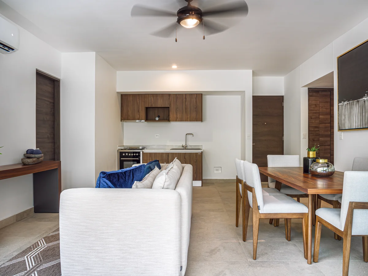 View of Modern Living Room at Tao Tulum, showcasing Open Concept Kitchen, Contemporary Interior.