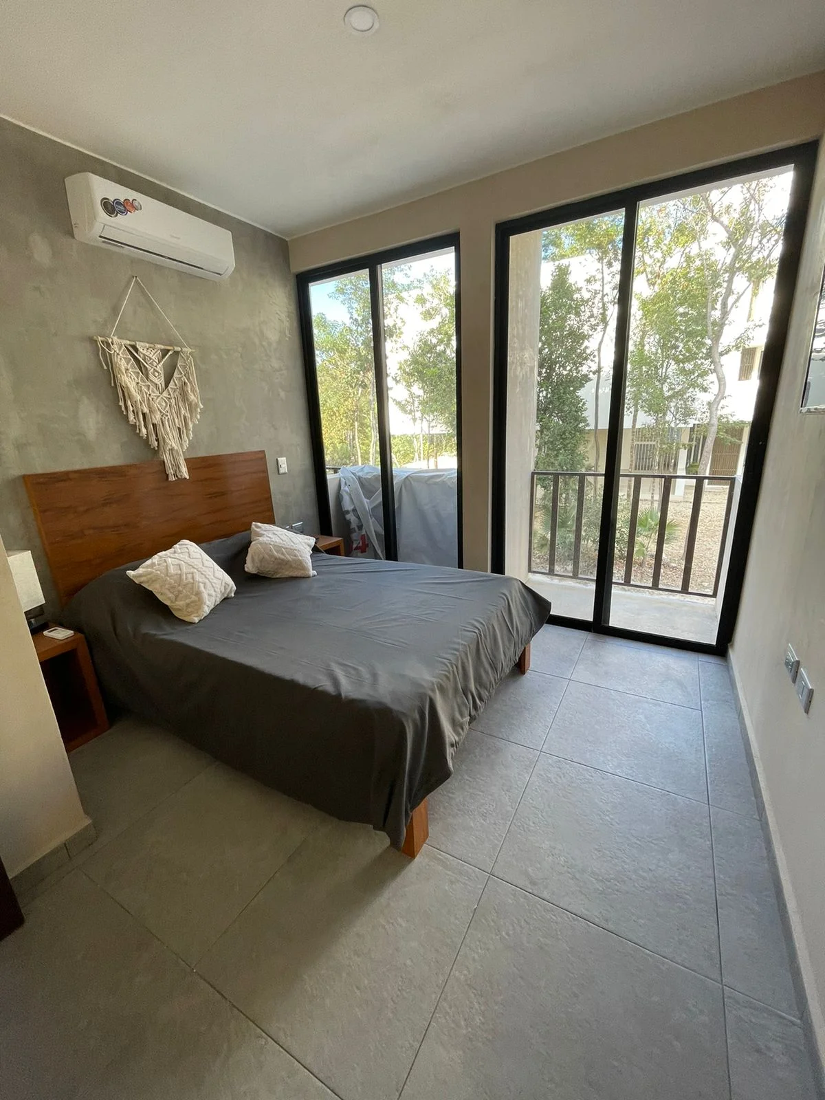 Image of a Bedroom, featuring Private Balcony and Sliding Glass Doors.