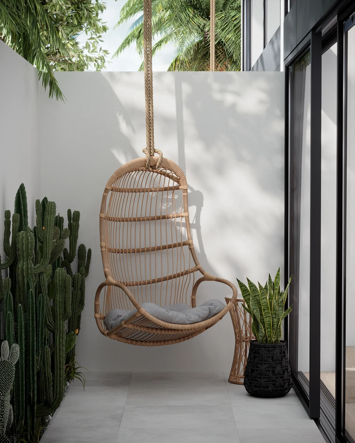 Image of a Private Patio, featuring Hanging Swing Chair and Tropical Landscaping.