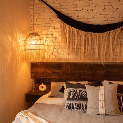 Image of a Cozy Bedroom, featuring White Brick Accent Wall and Bohemian-Chic Decor.