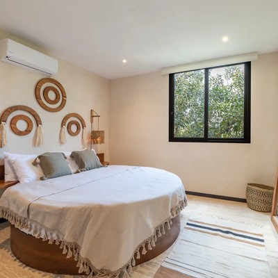 Image of a Bedroom, featuring Round Bed and Bohemian Decor.
