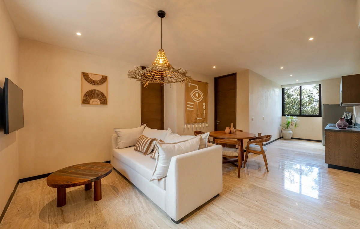 View of Open Concept Living at Ophelia, showcasing Boho Chic Decor, Travertine Flooring.