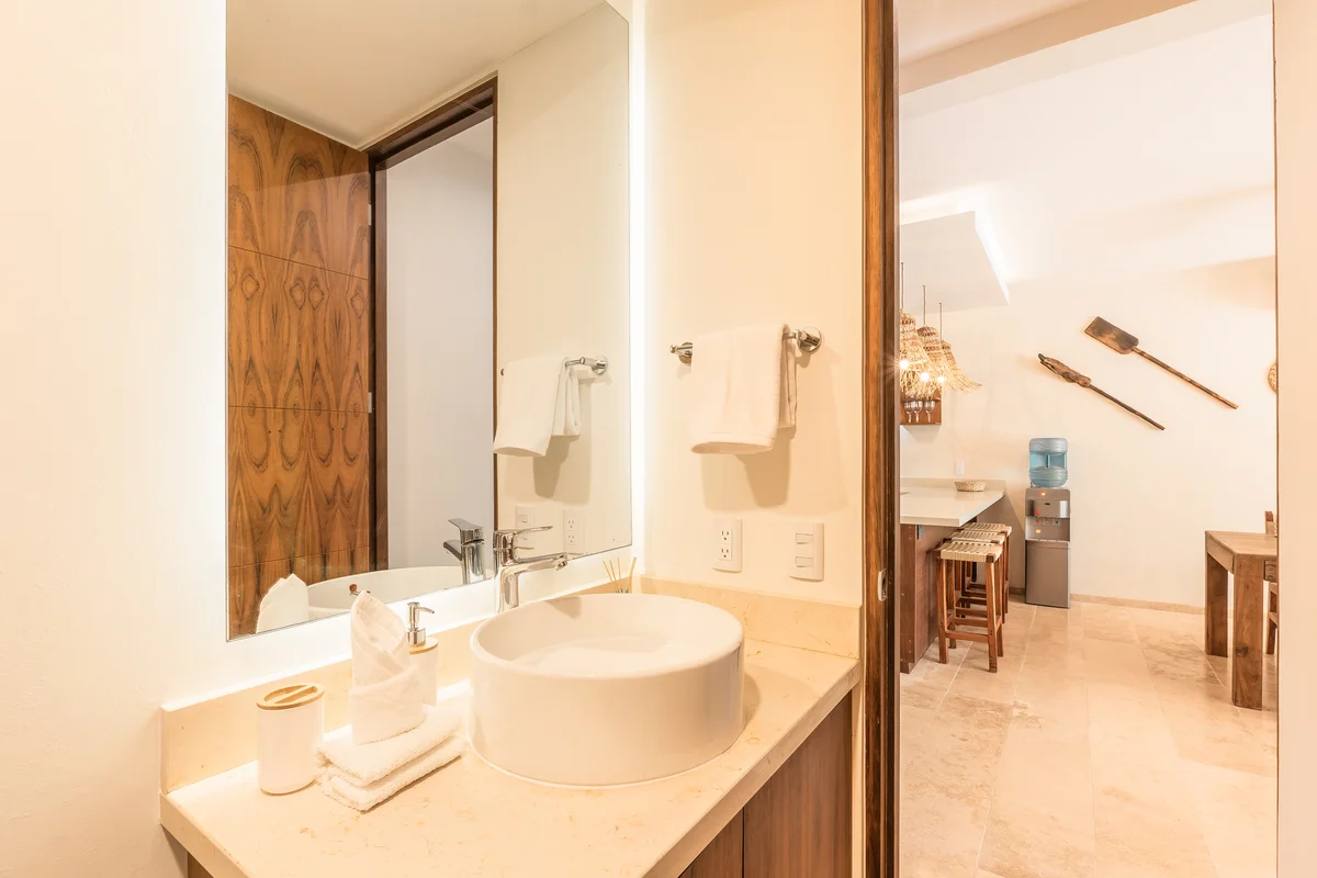 View of Modern Bathroom at Monarca, showcasing Vessel Sink, Stone Countertop.