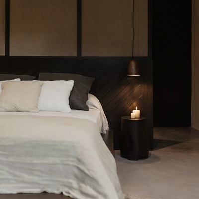 Image of a Primary Bedroom, featuring Minimalist Design and Custom Wood Headboard.