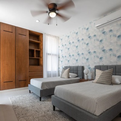 Image of a Twin Bedroom, featuring Built-in Wardrobe and Wooden Cabinetry.